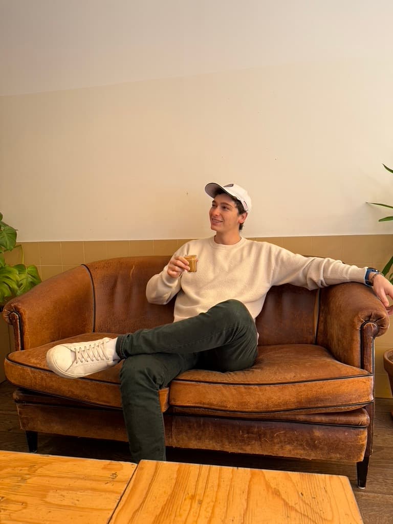 Paolo sitting and working at a cafe