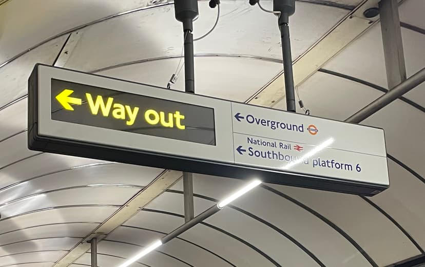 A sign from london underground that says 'WAY OUT'.